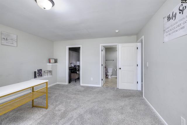 office space with baseboards and carpet