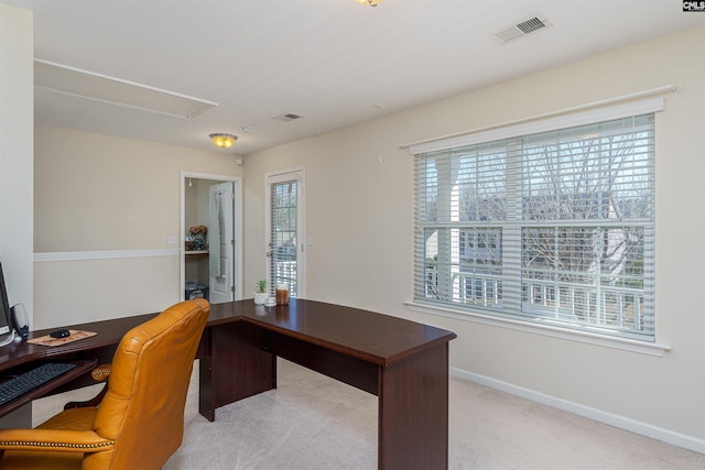 home office featuring visible vents, carpet floors, baseboards, and attic access