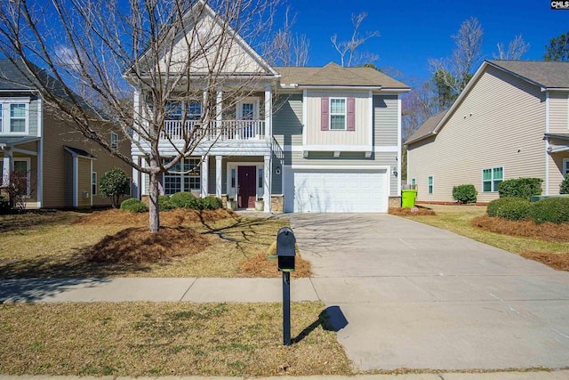 view of front of house featuring a garage, a balcony, and concrete driveway