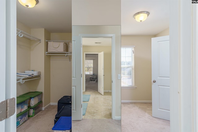 spacious closet with carpet flooring and visible vents