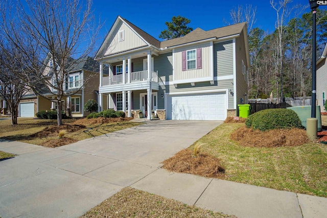 neoclassical / greek revival house featuring board and batten siding, concrete driveway, an attached garage, and fence