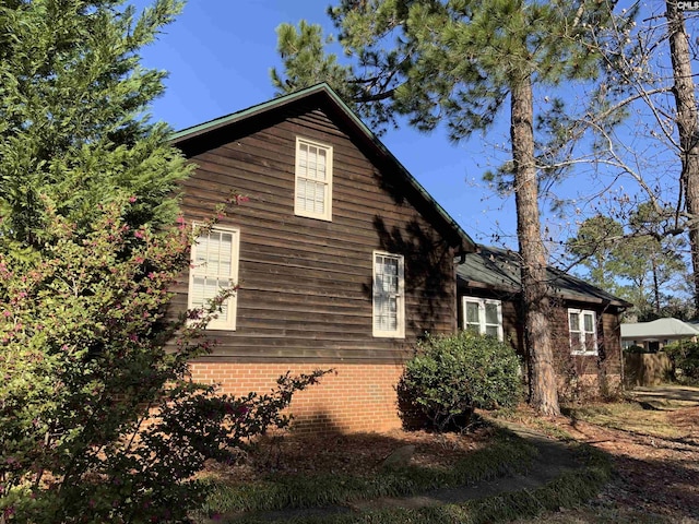 view of front of property featuring brick siding