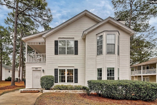 view of front of house with a balcony