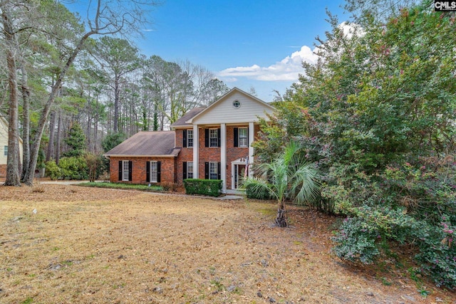 neoclassical / greek revival house with brick siding