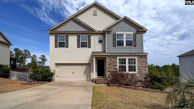 view of front of house featuring a front lawn, stone siding, fence, concrete driveway, and an attached garage