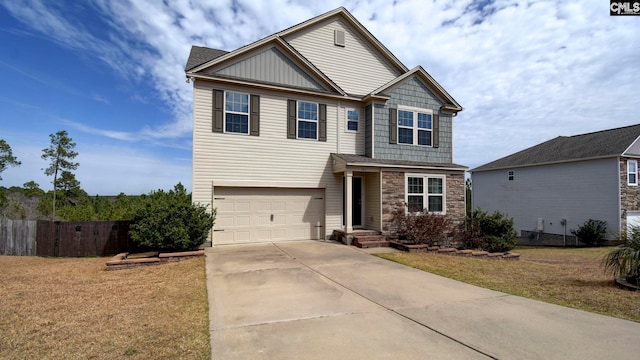 view of front of home featuring a front yard, fence, an attached garage, concrete driveway, and stone siding