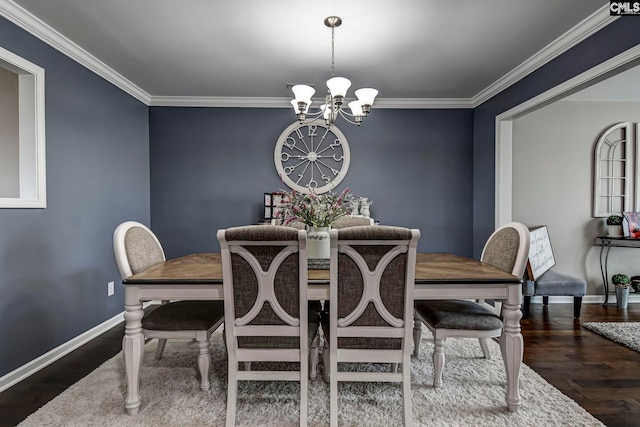 dining area featuring an inviting chandelier, wood finished floors, and crown molding