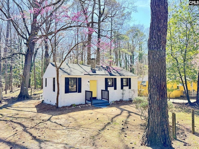 view of front of home with brick siding