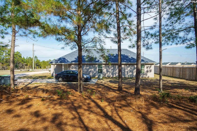 rear view of property with fence