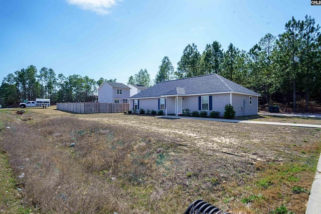 single story home with fence