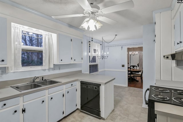 kitchen with black appliances, light countertops, a peninsula, and a sink