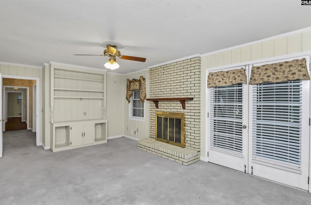 unfurnished living room with a brick fireplace, carpet, and ornamental molding