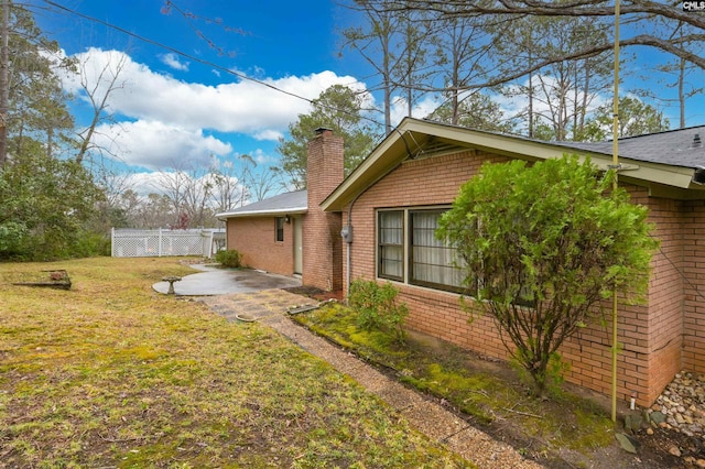 view of yard featuring a patio area and fence