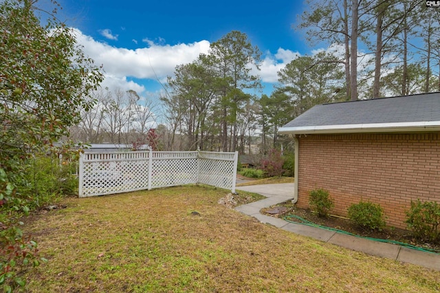 view of yard with a wooden deck