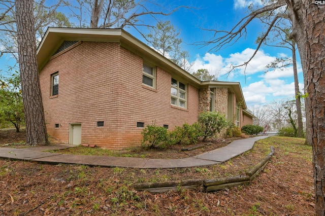 view of side of property featuring crawl space