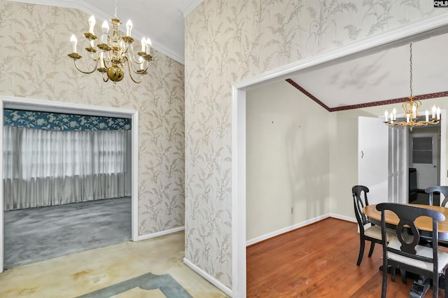 dining area featuring baseboards, an inviting chandelier, ornamental molding, and wallpapered walls