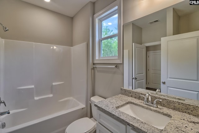 bathroom with vanity, toilet, visible vents, and shower / bathtub combination