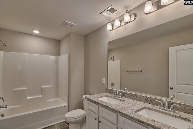 bathroom with toilet, visible vents, and a sink