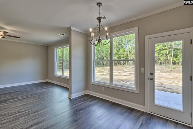 unfurnished dining area with visible vents, dark wood-type flooring, baseboards, and ornamental molding