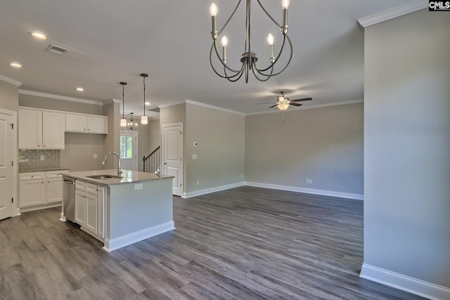 kitchen featuring visible vents, a sink, white cabinets, stainless steel dishwasher, and backsplash