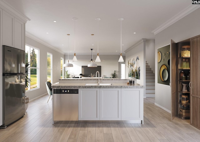 kitchen with white cabinetry, stainless steel appliances, light wood-type flooring, and a sink