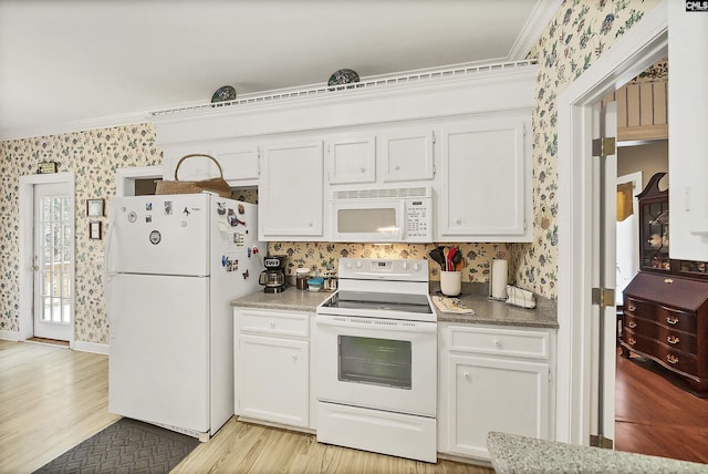 kitchen with ornamental molding, wallpapered walls, white cabinetry, white appliances, and light wood finished floors