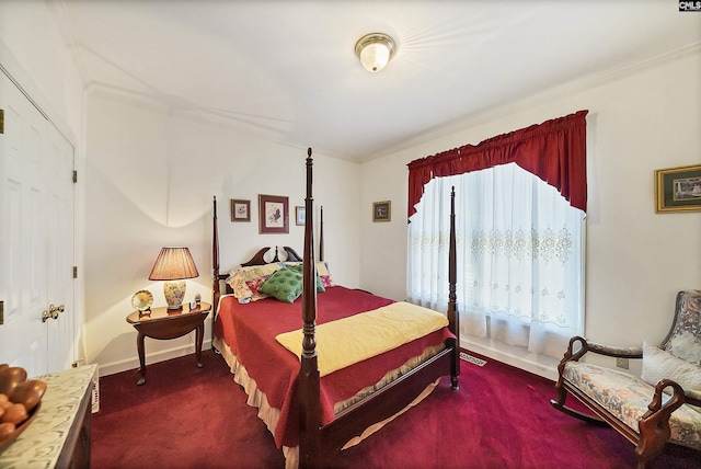 bedroom with baseboards and dark carpet