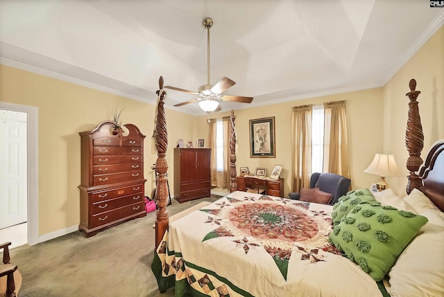 carpeted bedroom featuring baseboards, a ceiling fan, and crown molding