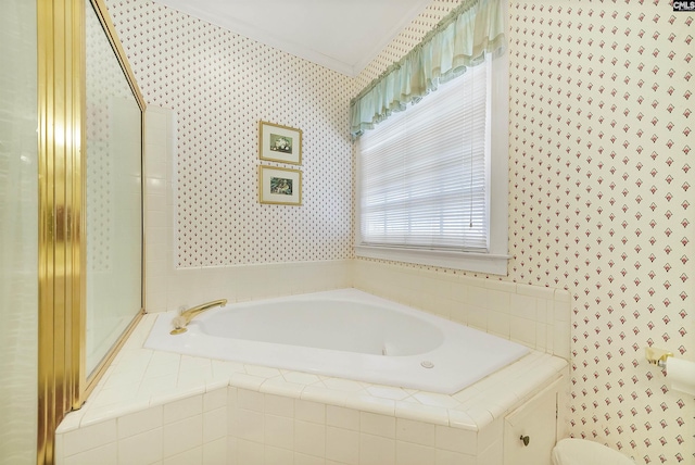 bathroom with wallpapered walls, a garden tub, toilet, and ornamental molding