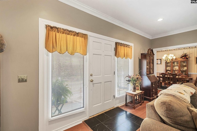 foyer featuring dark wood-style floors, baseboards, an inviting chandelier, and ornamental molding