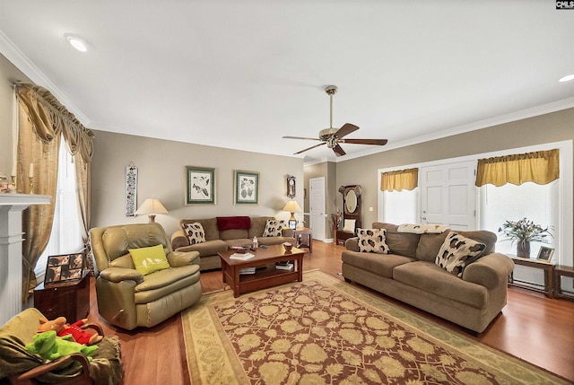 living room with recessed lighting, ceiling fan, crown molding, and light wood-style floors