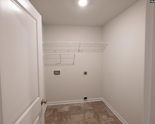 laundry area with electric dryer hookup, hookup for a washing machine, baseboards, and laundry area