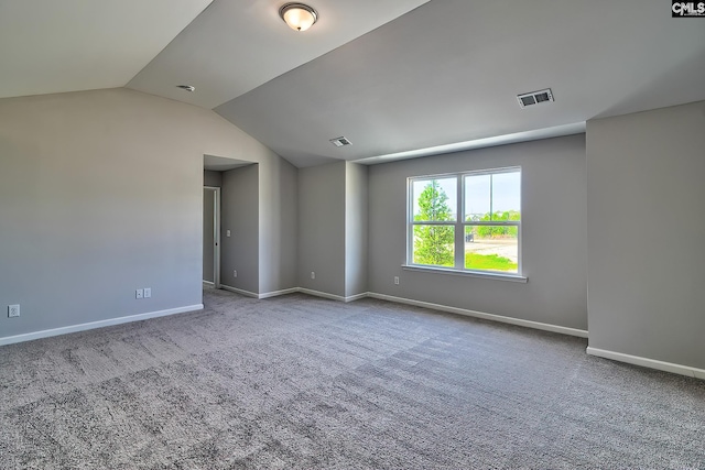 unfurnished room with carpet flooring, baseboards, and visible vents