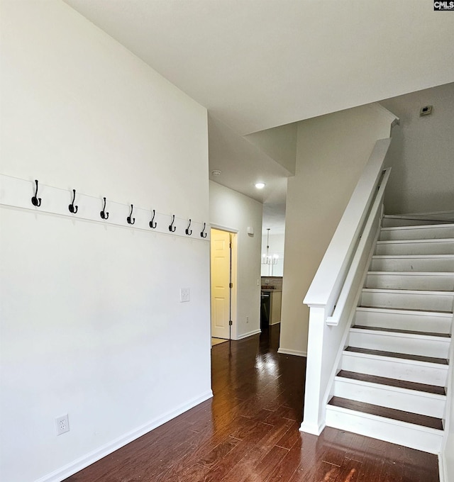 interior space featuring wood finished floors and baseboards