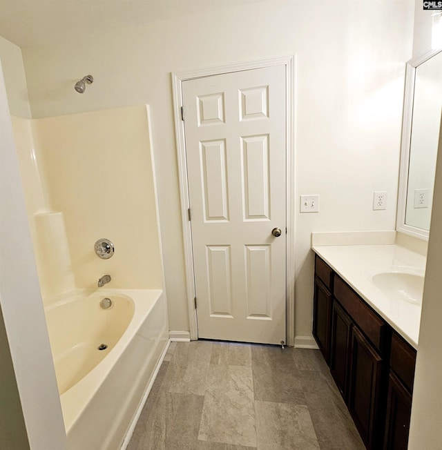 full bathroom featuring vanity and baseboards