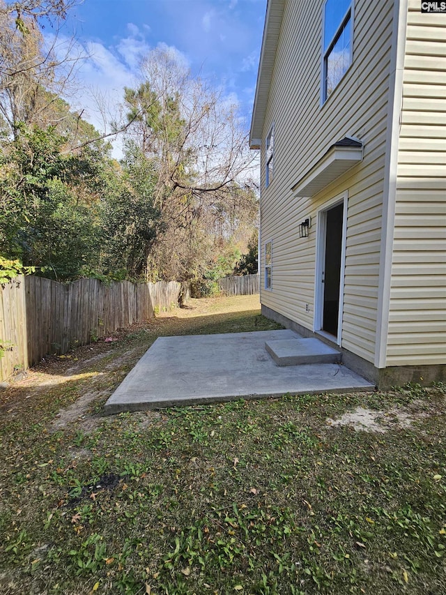 view of yard with fence private yard and a patio