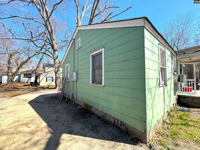 view of side of property featuring cooling unit