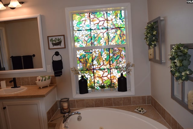 bathroom with vanity and a whirlpool tub