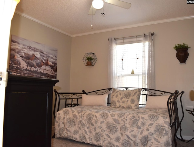 carpeted bedroom featuring a textured ceiling, a ceiling fan, and ornamental molding