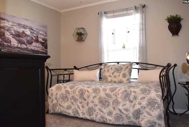 bedroom with carpet floors and crown molding