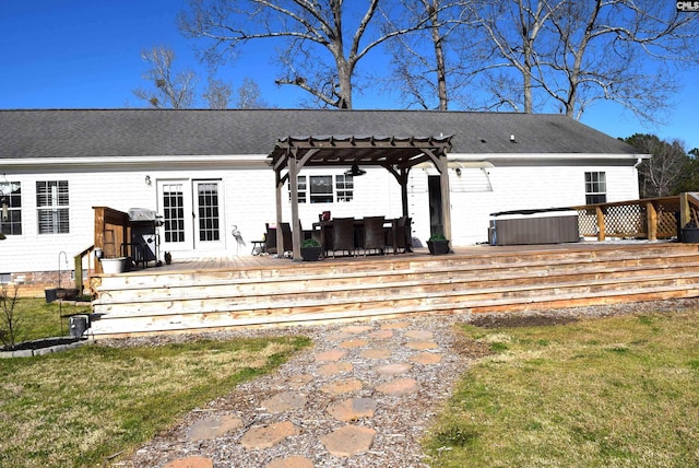 rear view of property with a hot tub, a shingled roof, cooling unit, a deck, and a pergola