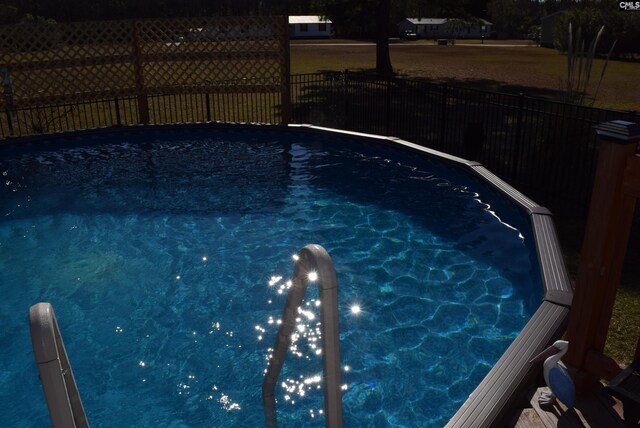 view of pool with fence