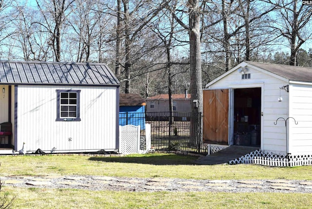 view of shed with fence