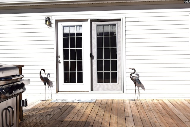 property entrance with a deck