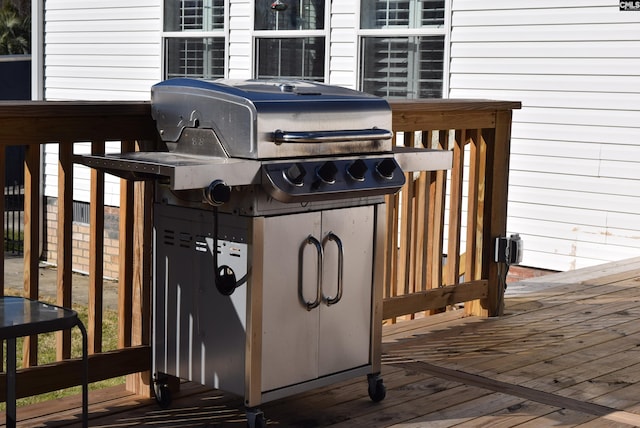 wooden terrace featuring grilling area