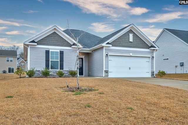 craftsman-style house with concrete driveway, a garage, and a front lawn