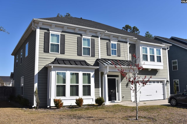 view of front of property featuring metal roof, driveway, an attached garage, and a standing seam roof