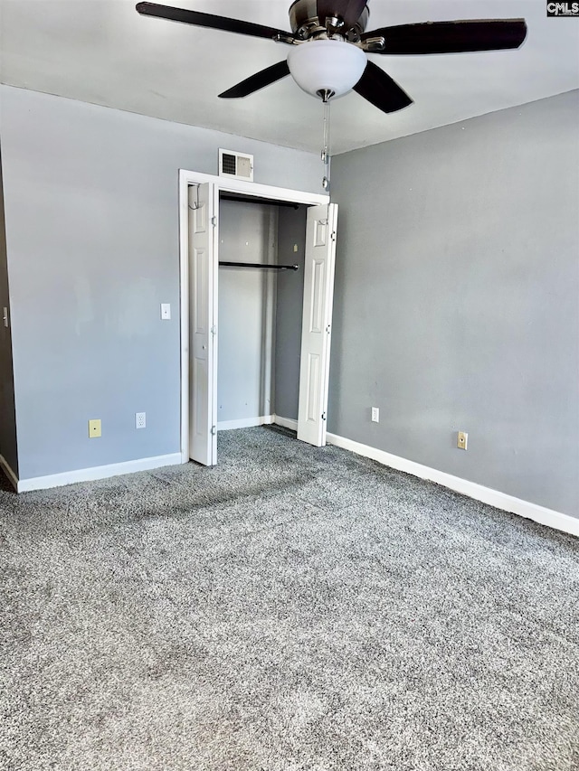 unfurnished bedroom featuring a closet, visible vents, ceiling fan, and baseboards