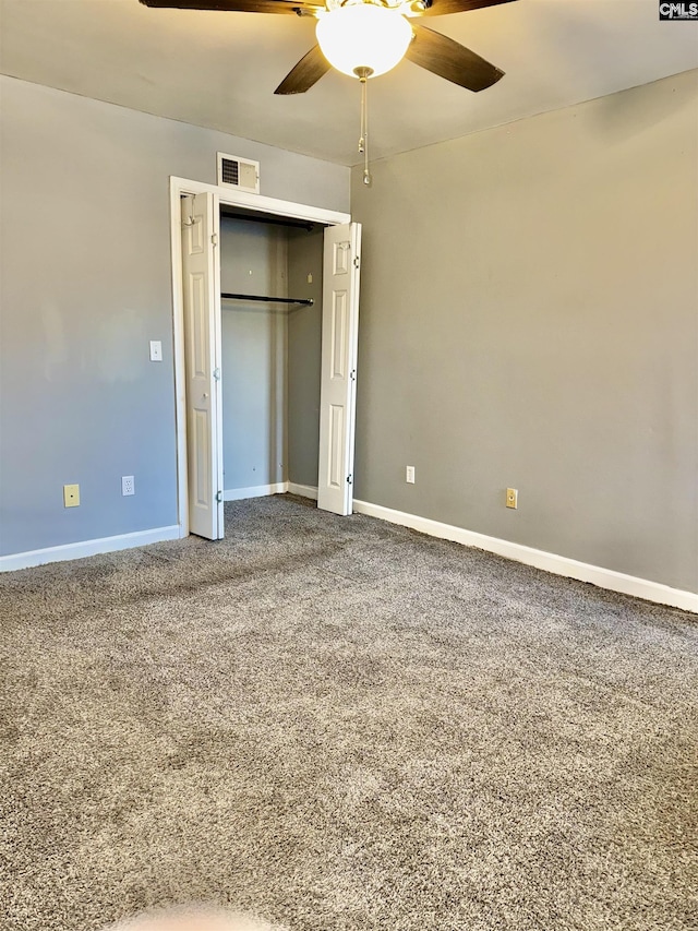 unfurnished bedroom featuring visible vents, ceiling fan, baseboards, carpet flooring, and a closet