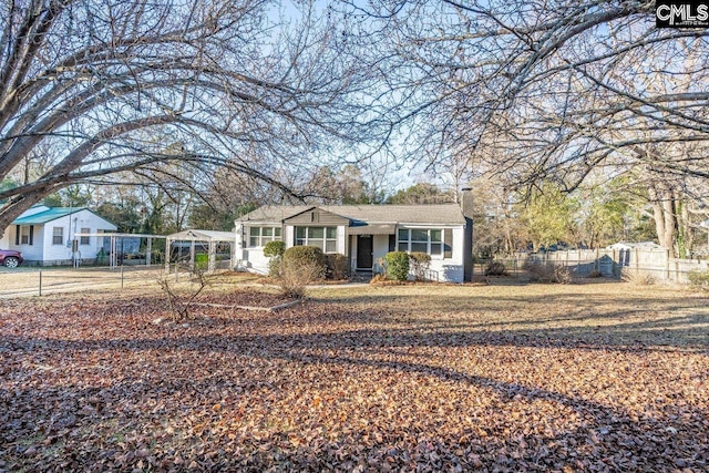 view of front of home with fence